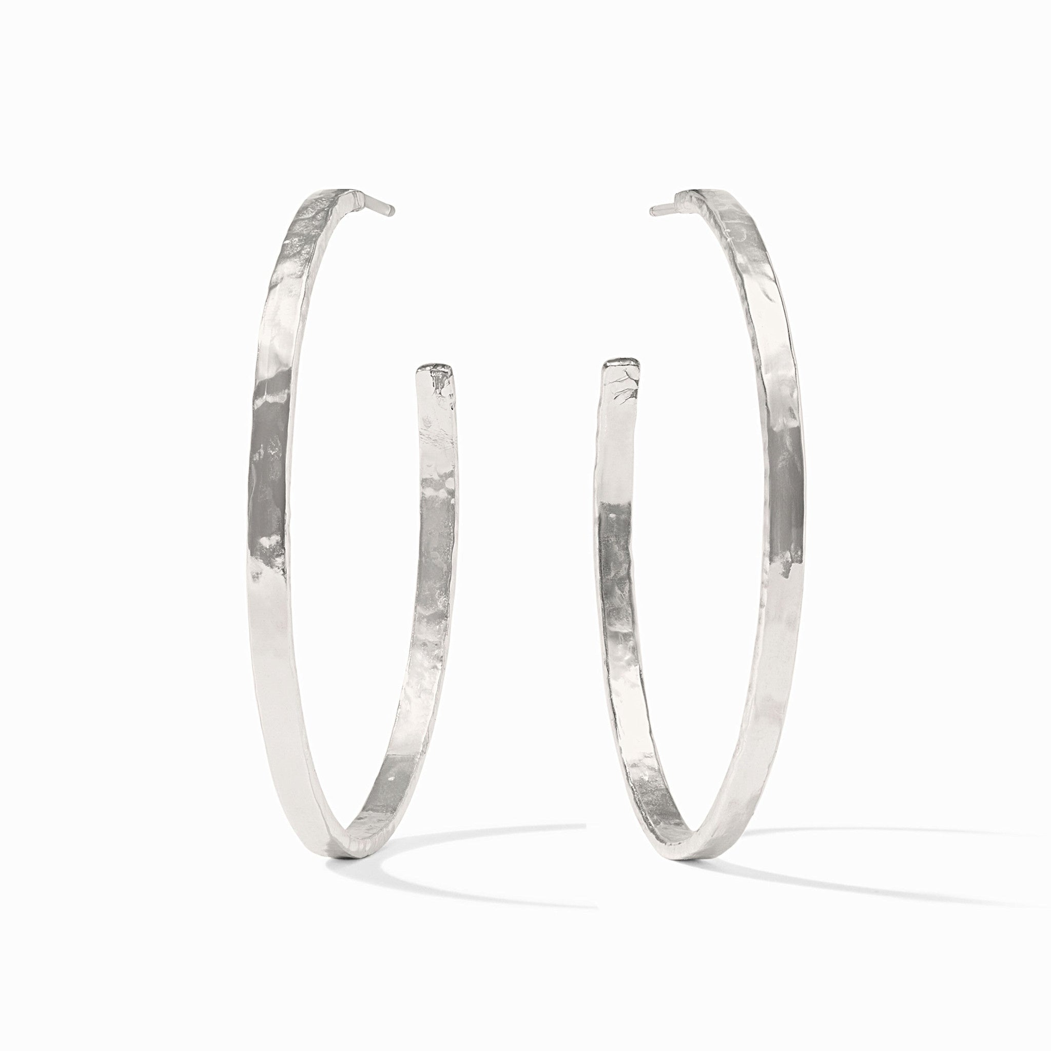 Silver plated crescent hoop earring with a lightly hammered texture.
