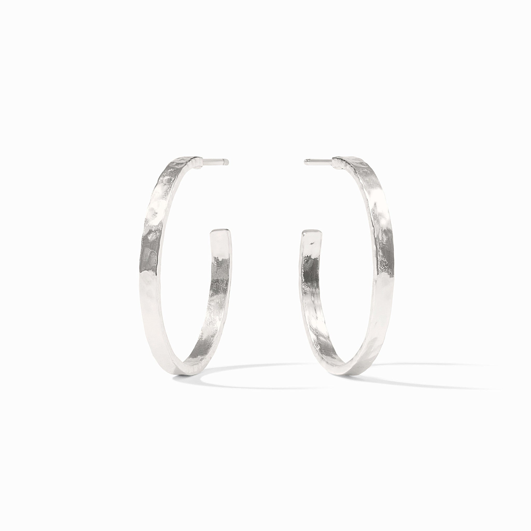 Silver plated crescent hoop earring with a lightly hammered texture.