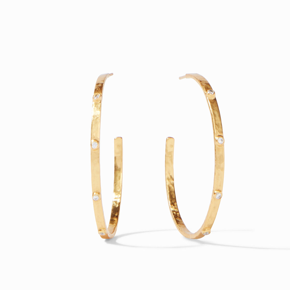 Gold-plated crescent hoop earring with hammered texture and cubic zirconia gemstone accents.