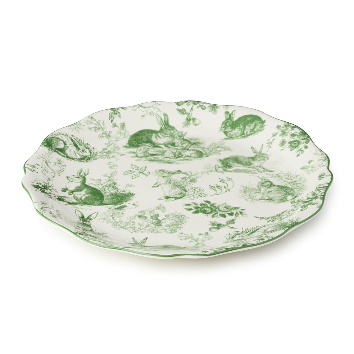 Round ceramic platter with scalloped rim featuring delicate green French garden artwork on a white background.
