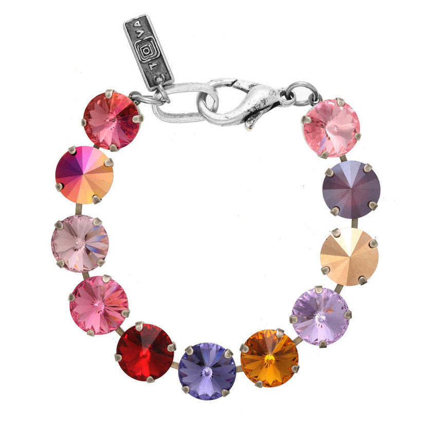 Antique gold plated brass Croatia bracelet with pink crystals on a chain link.