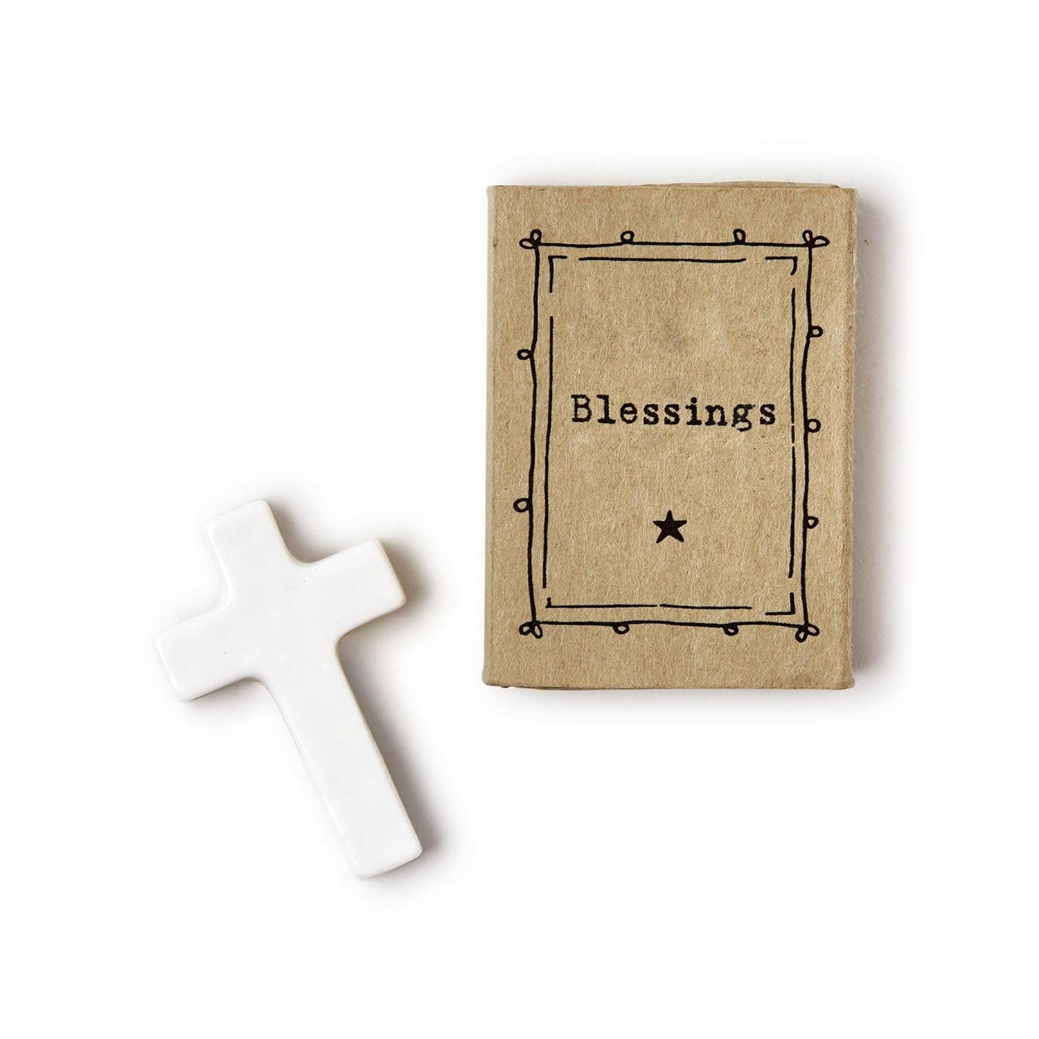 Porcelain cross in a matchbox gift box labeled Blessings