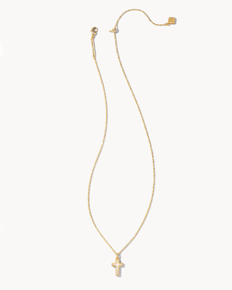 Gold cross pendant necklace featuring a white Kyocera opal stone on an 18-inch chain.