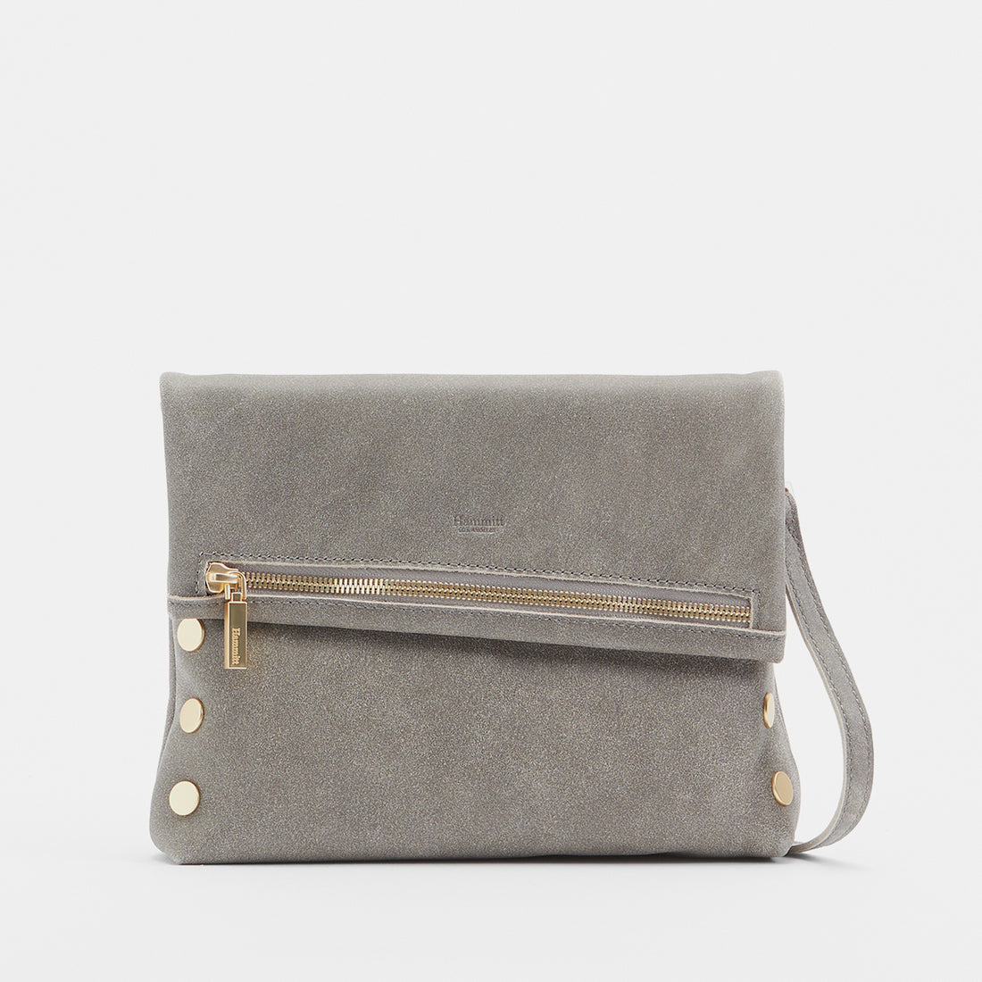 Medium zippered bag in buttery black leather with brushed gold rivets and a subtle red seam detail.