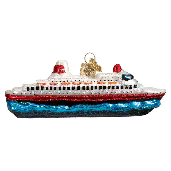 Red cruise ship ornament with white sails standing on a gold base.