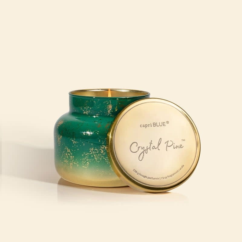 Crystal Pine Glimmer jar candle with emerald green wax and metallic foil accents.
