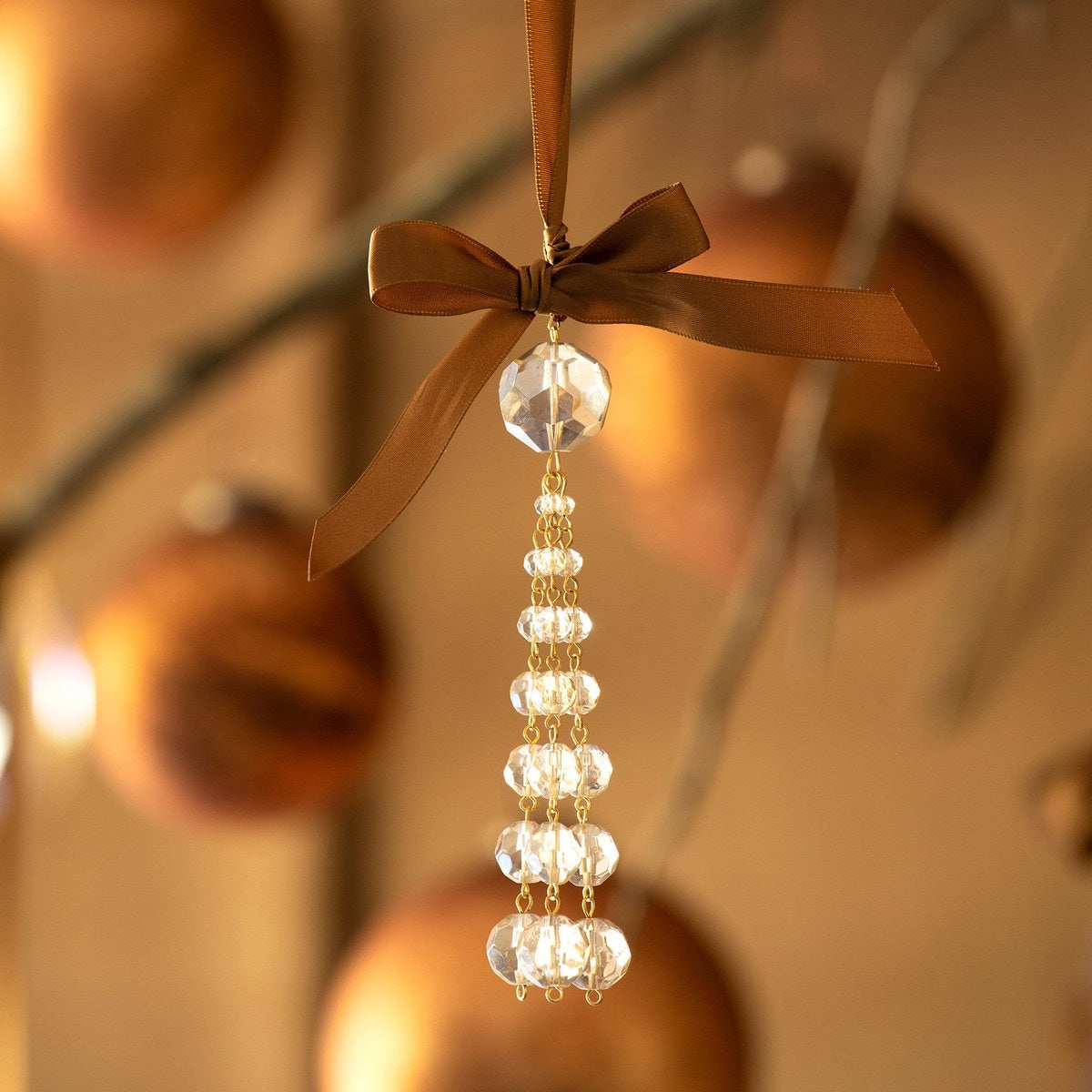 Clear glass crystal tassel ornament with dangling faceted beads.