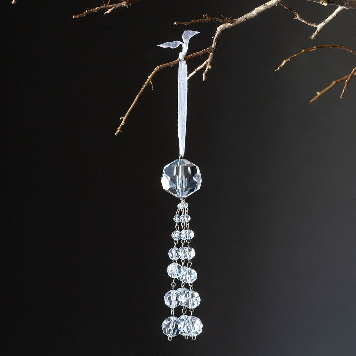 Clear glass crystal tassel ornament with dangling clear strands.