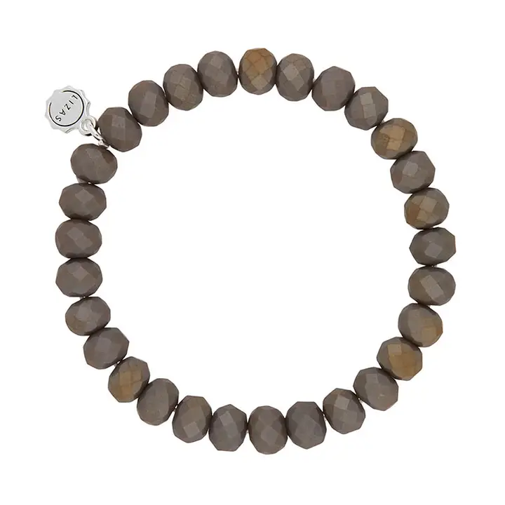 Lizas Quadro Big crystal stretch bracelet with faceted grey beads and a silver logo charm.