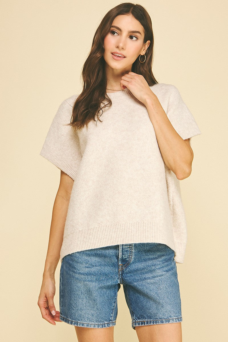 Bailey solid knit sweater in cap sleeve silhouette with a relaxed fit.