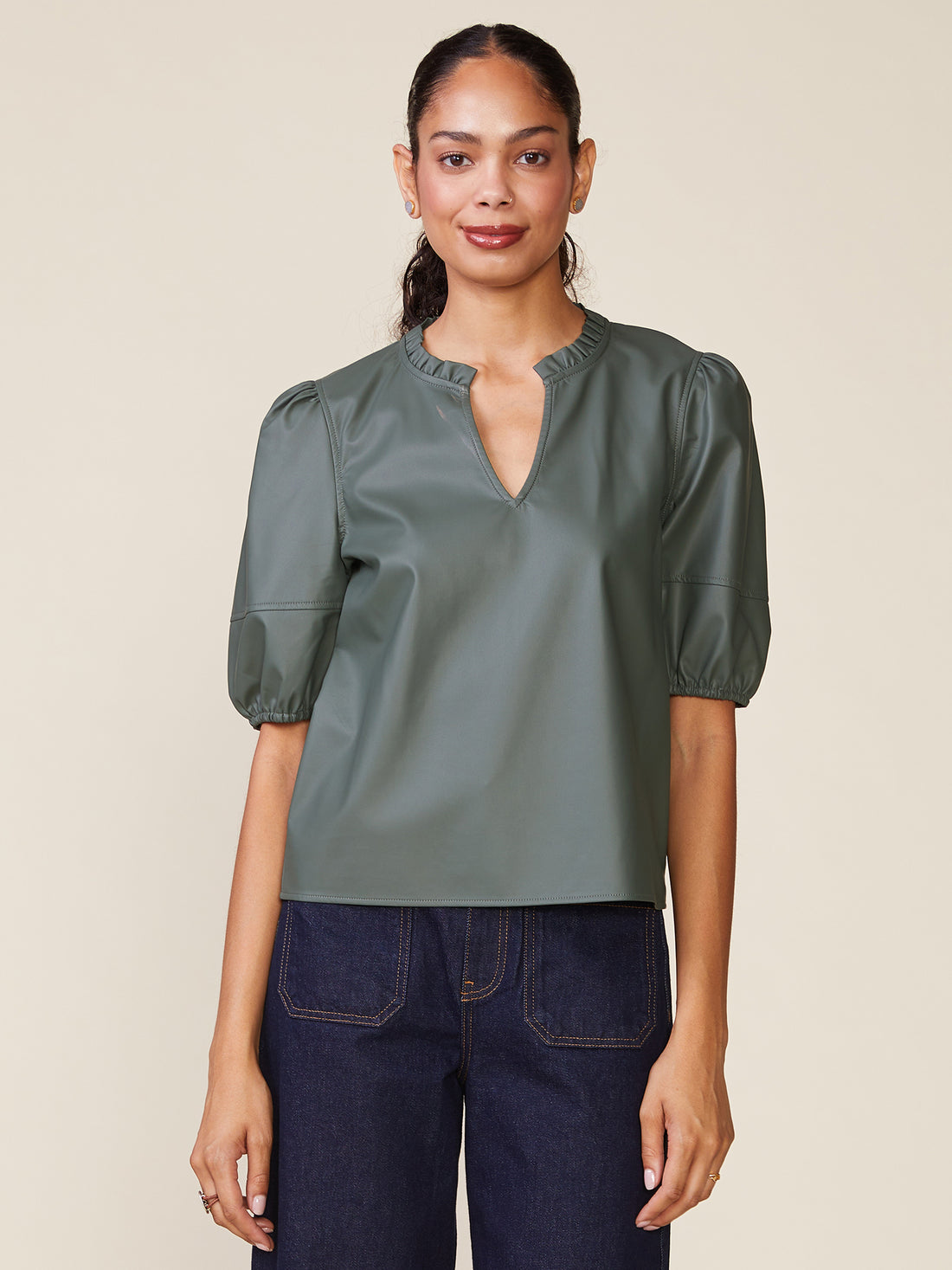 Kacey vegan leather blouse in black with a relaxed fit.