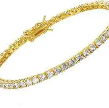Gold tennis bracelet featuring a continuous row of round-cut clear crystals with a box clasp.