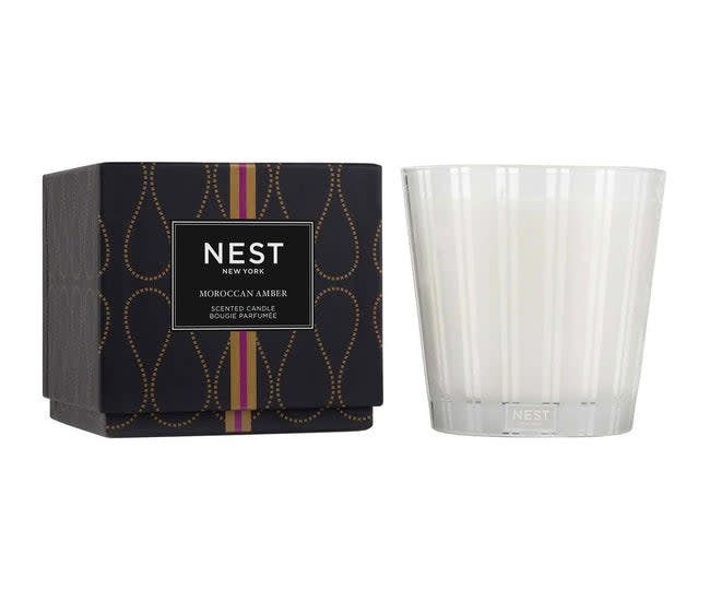 Nest 3-Wick candle in a clear glass jar with white wax.