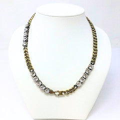 Gold Cuban link necklace with three diamond stations measuring 17 inches in length.