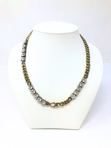 17-inch Cuban gold link necklace featuring three stations of clear fashion diamonds.