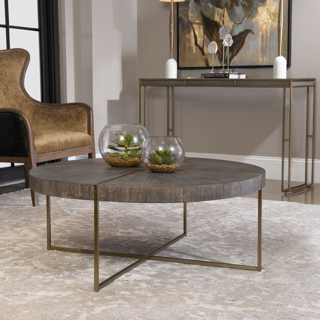 Round coffee table with brushed brass stainless steel frame and dark walnut acacia veneer top.