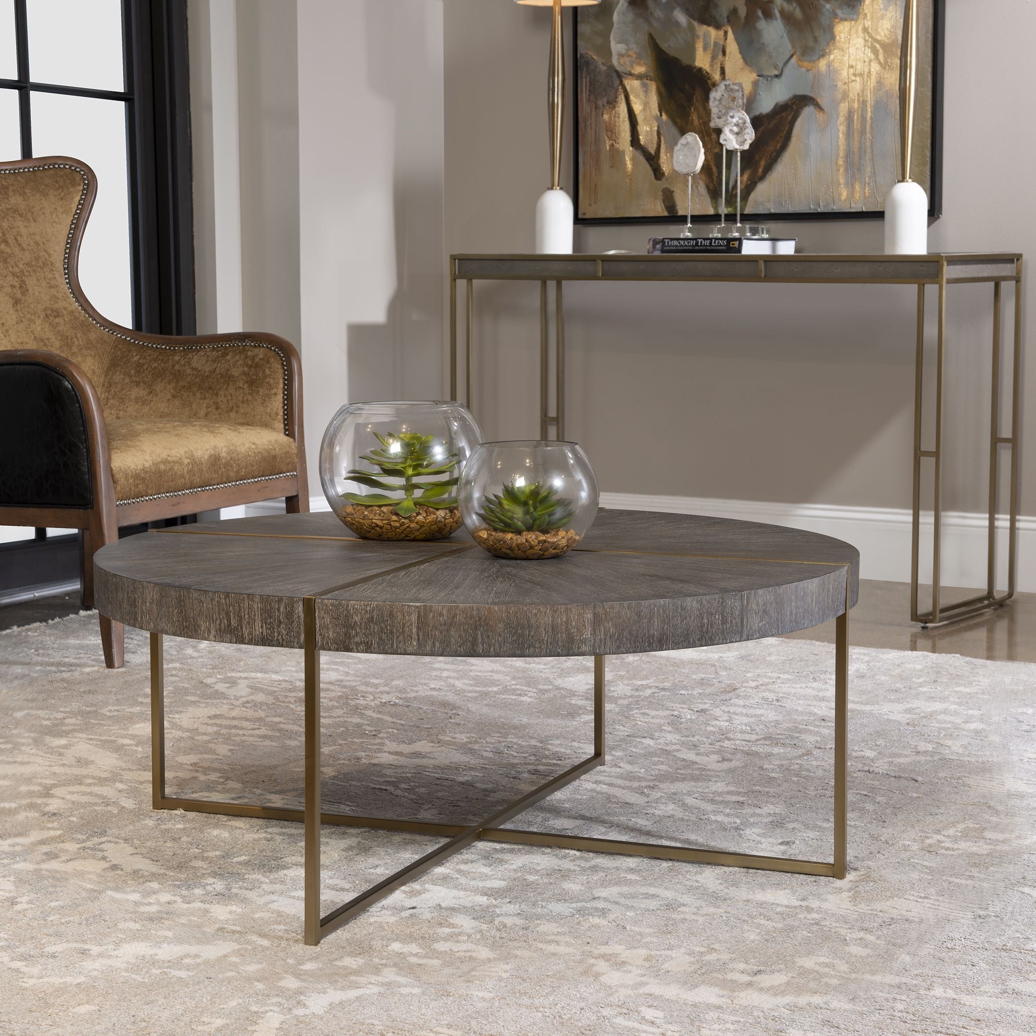 Round coffee table with brushed brass stainless steel frame and dark walnut acacia veneer top.