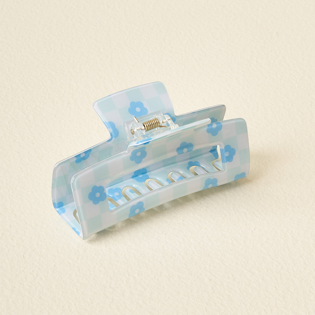 Clear plastic check claw clip with printed checkerboard pattern