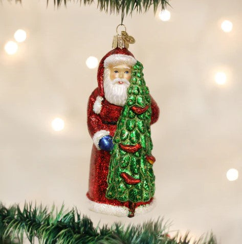 Santa With Calling Birds glass ornament featuring Santa in a red robe holding a green tree.