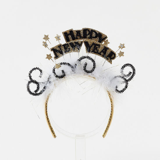 Happy New Year headband with gold glitter text, white feathers, and black tinsel swirls.