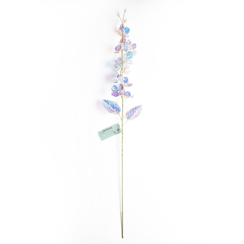 Artificial floral stem with red roses in a vase