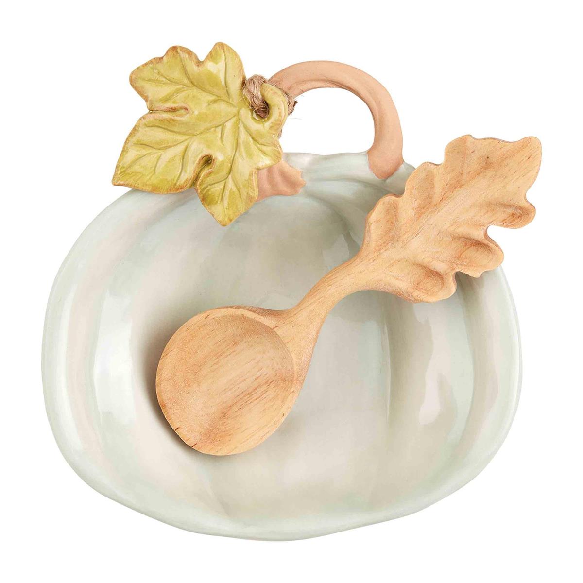 Hand-painted orange pumpkin-shaped ceramic dish with a wooden spoon.