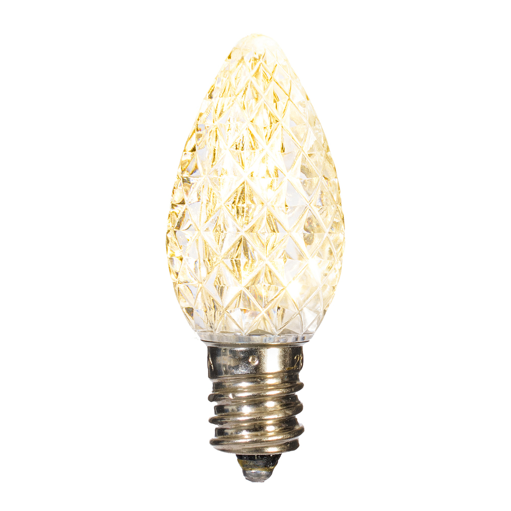 C7 LED warm white faceted replacement bulb with a diamond-patterned lens and silver screw base.