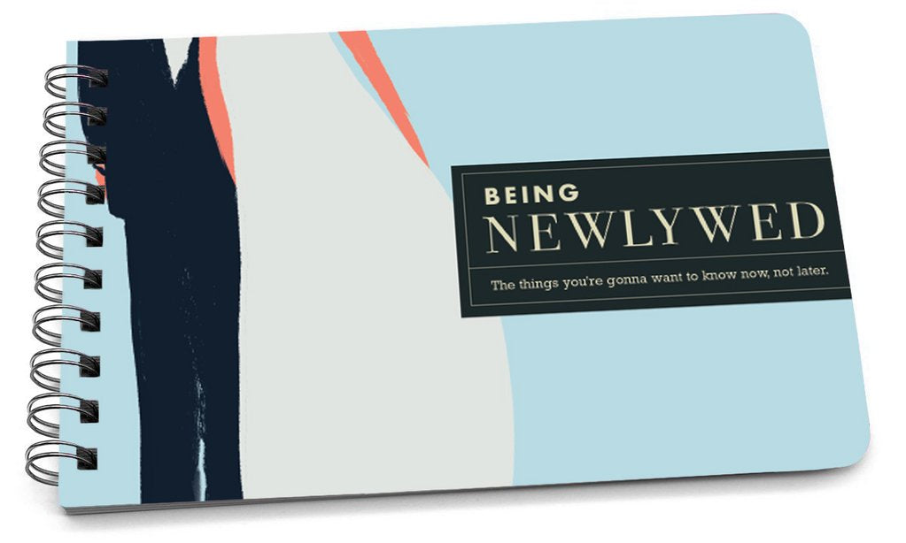 Spiral-bound handbook with a light blue cover featuring abstract art and the title "Being Newlywed."