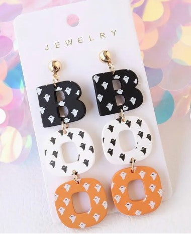 Halloween BOO earrings featuring a black silhouette with white ghost face on gold-tone studs.