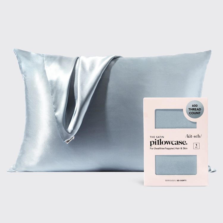 Satin pillowcase in a soft neutral tone with smooth texture.
