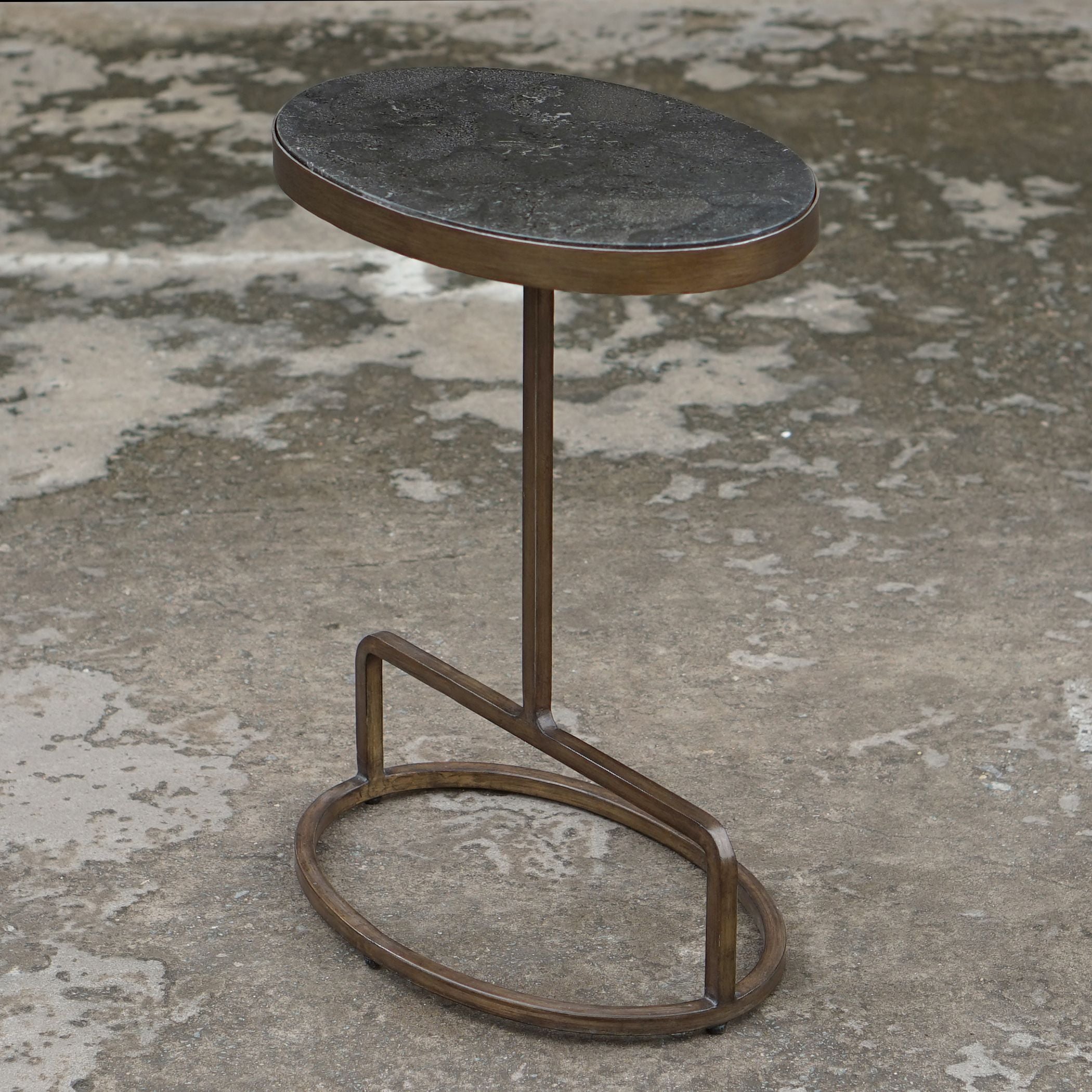 Jessenia stone accent table with a rectangular top in neutral gray tones supported by four tapered legs.