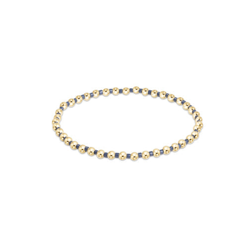 Hope Grateful bracelet featuring mixed 2mm seed beads in spring colors with gold-filled accents on elastic cord.