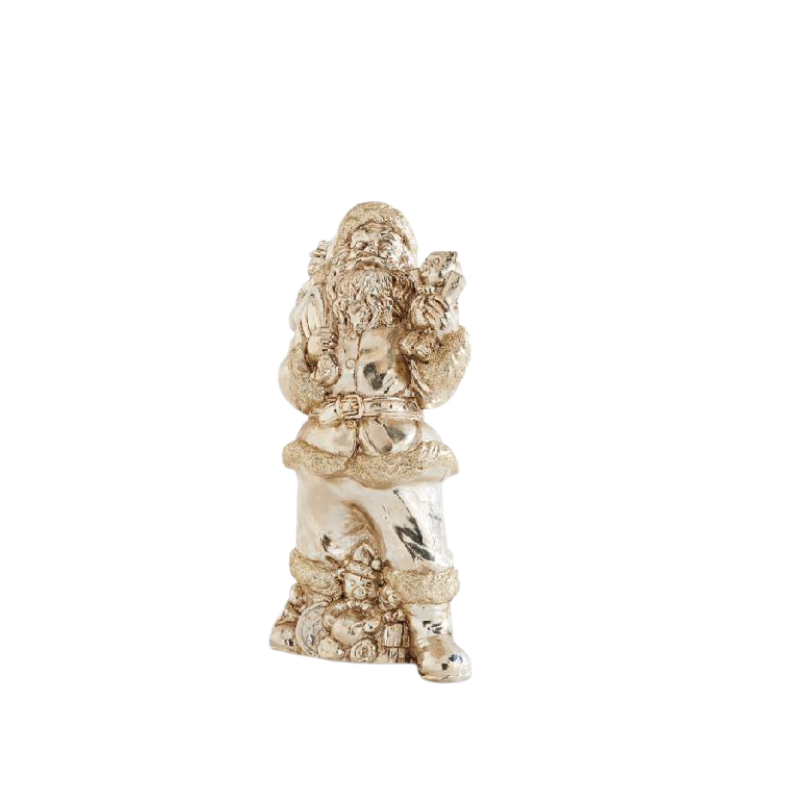Gold vintage Santa figurine holding a sack of gifts and a small tree.