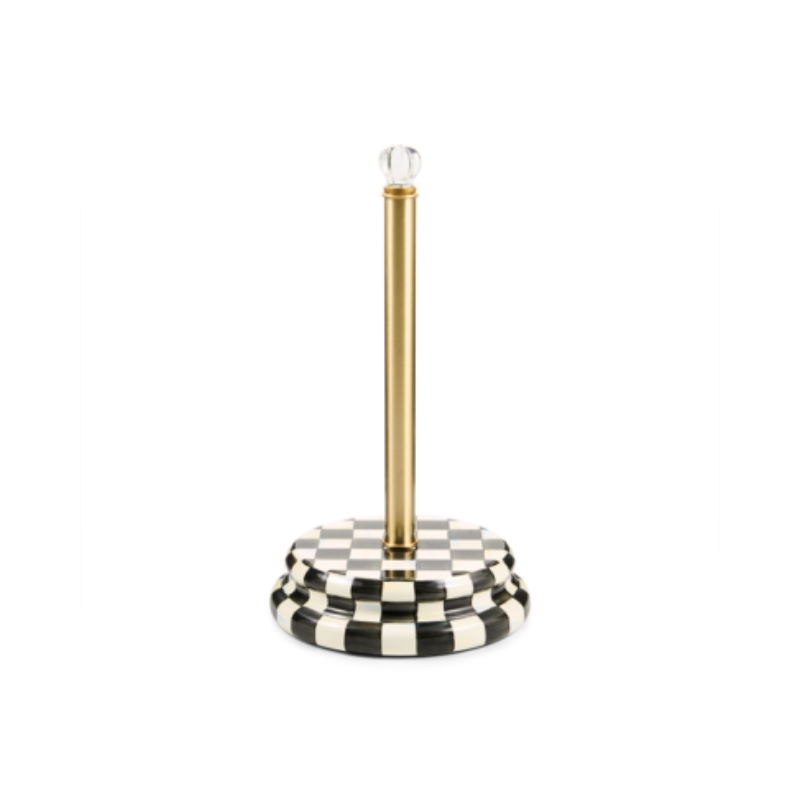 Check paper towel holder with a black and white checkered base, gold post, and glass knob.