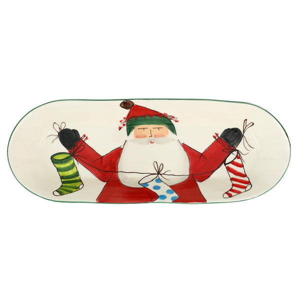 Old St. Nick Bread Server with a hand-painted Santa holding three colorful Christmas stockings.