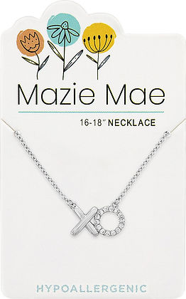 Silver Mazie Mae necklace with an 'XO' pendant on a white display card with floral illustrations.