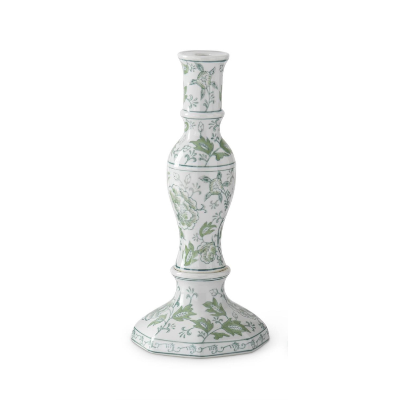 Single white ceramic taper candleholder with green floral patterns and a hexagonal base.