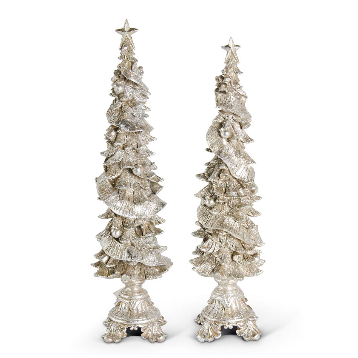 Two glittered champagne resin Christmas trees with star toppers and ornate pedestal bases.