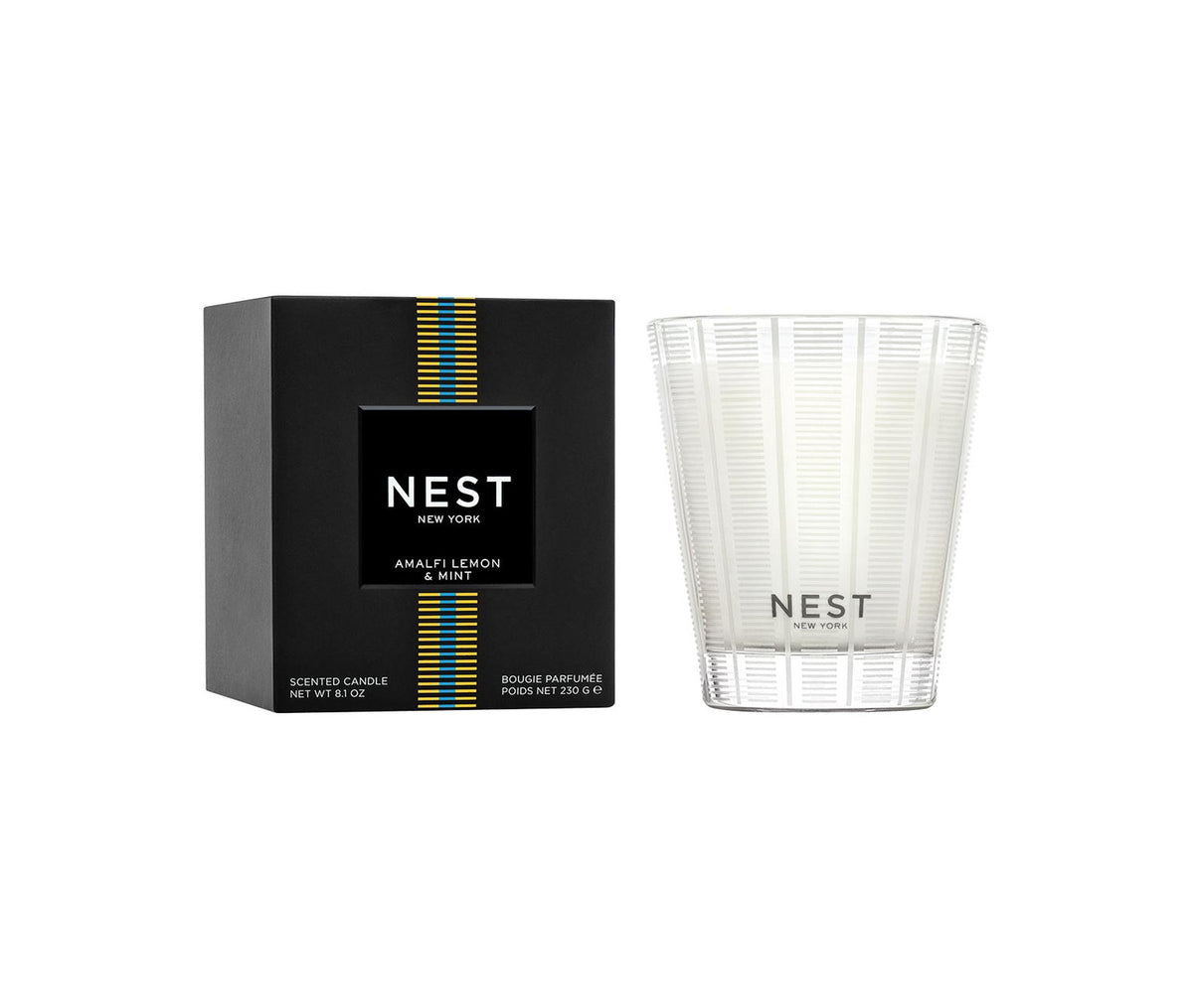 Nest Amalfi Lemon & Mint Classic Candle in a clear textured glass jar next to its black box.