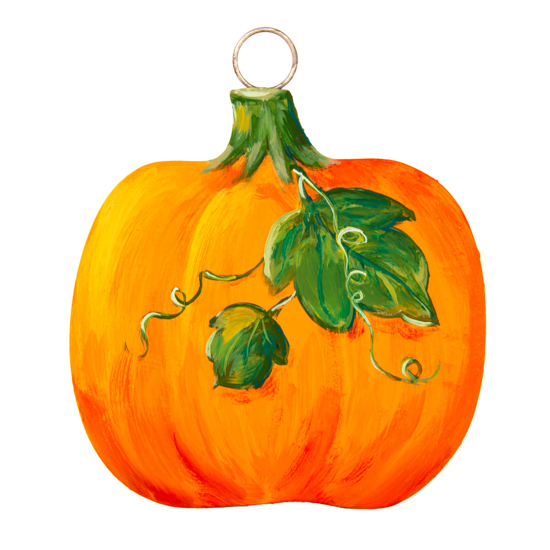 Painted metal pumpkin charm with green leaves and a metal hanging loop.