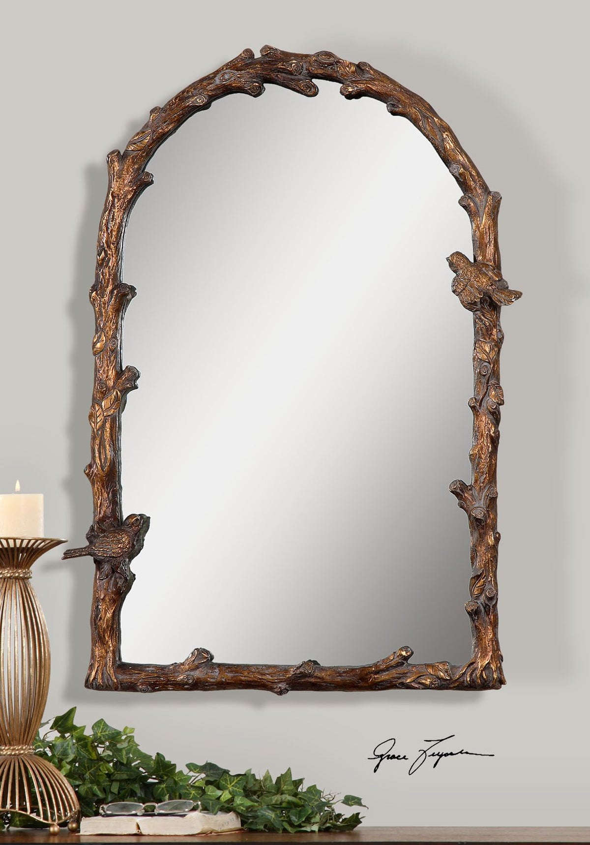 Antique gold arch mirror with a decorative frame