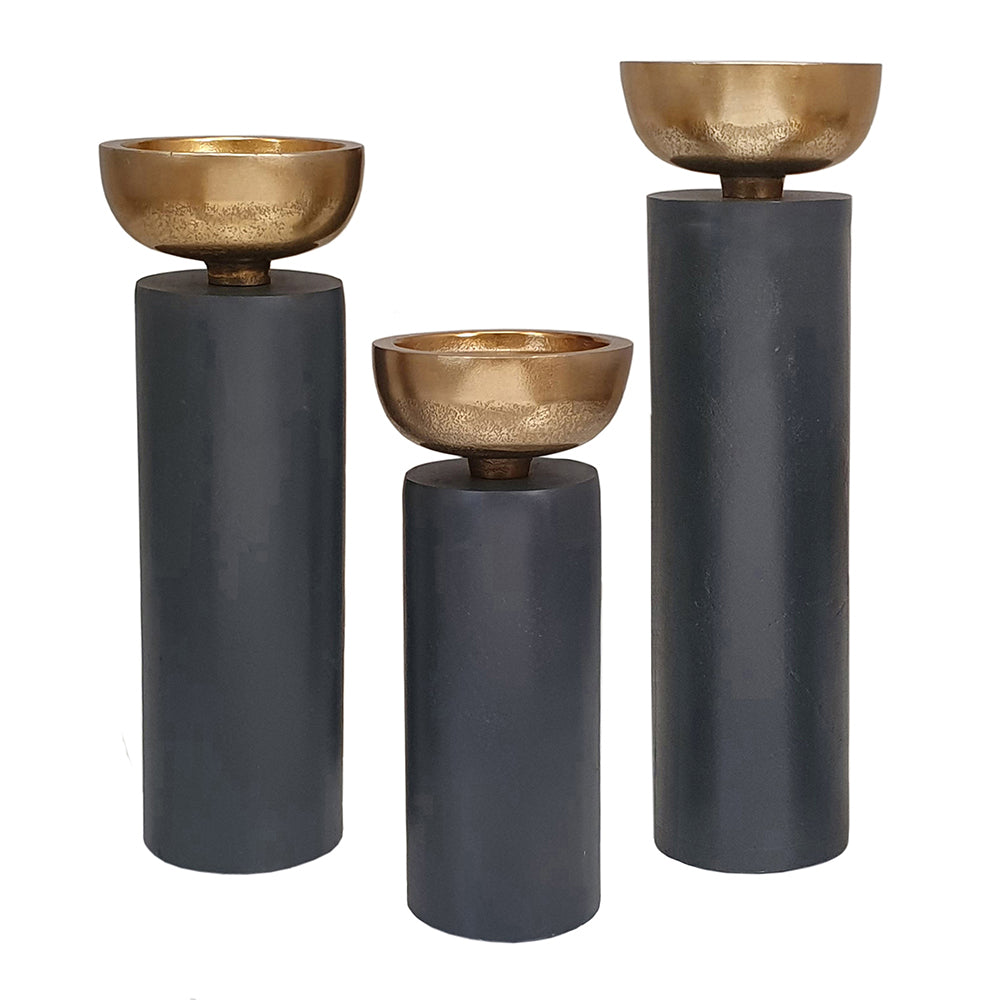Two tall aluminium pillar candle holders with a sleek cylindrical shape.