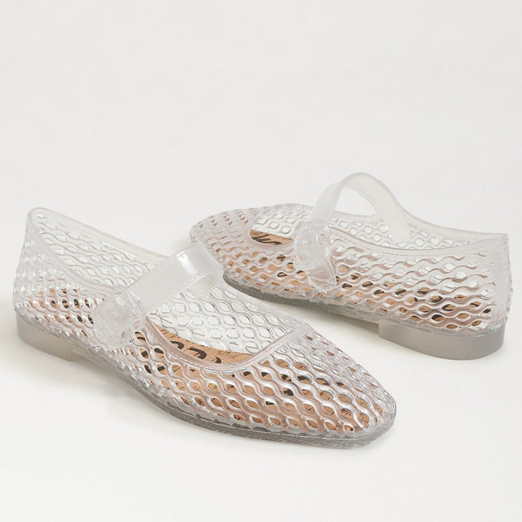 A pair of clear Michaela Jelly Flats with a round toe, buckle strap, and woven lattice pattern.