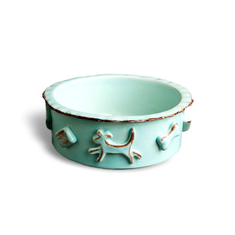 Medium stoneware dog food bowl with raised decorative appliques around the rim.