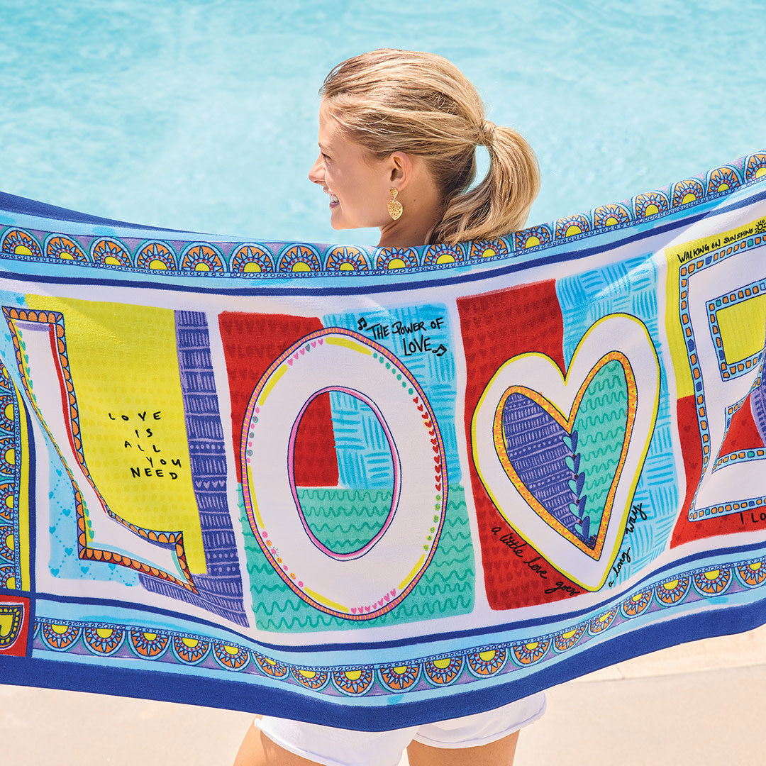 Endless Summer beach towel featuring a vibrant tropical leaf print on soft absorbent fabric.