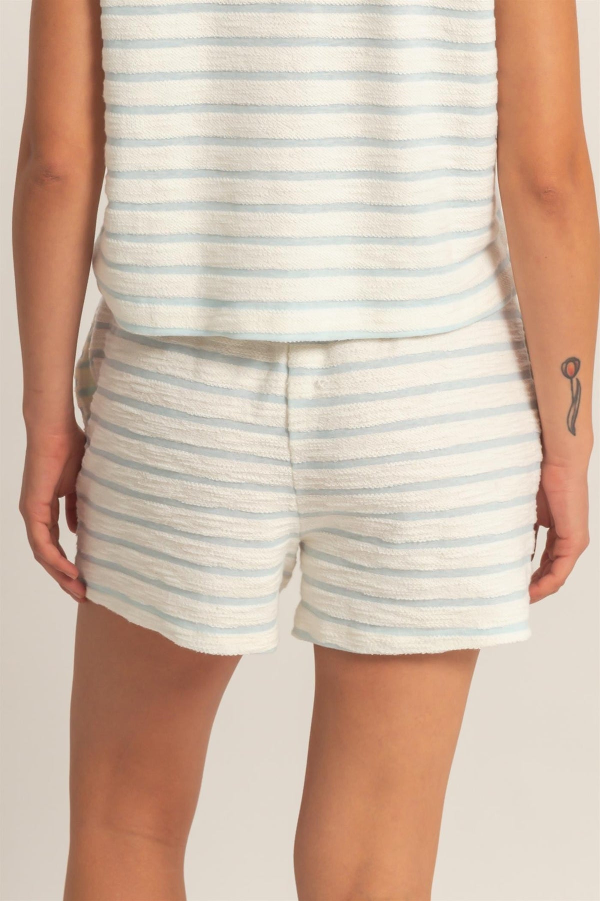 Women's striped drawstring waist shorts in cotton polyester blend with relaxed fit.