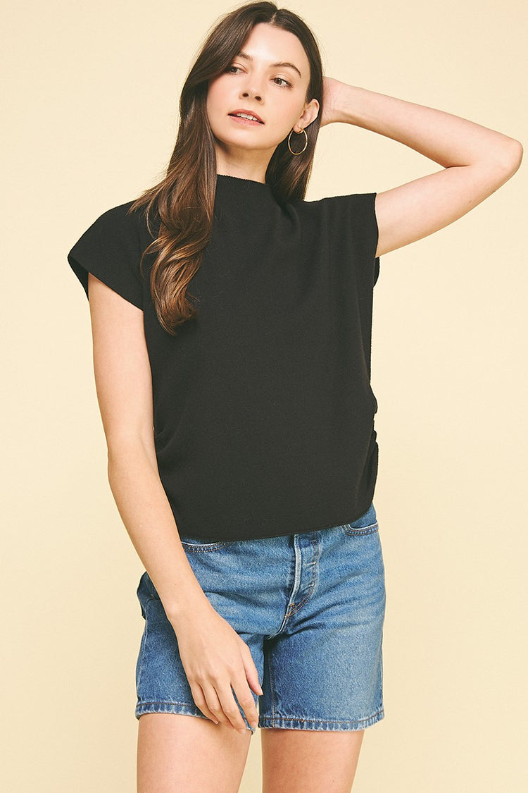 Chloe sweater vest in black with mock neck cap sleeves and side shirring detail.