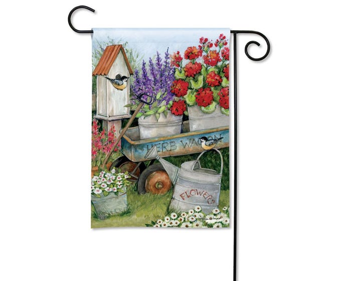 Garden flag with a watercolor painting of a birdhouse, flowers, and a watering can.