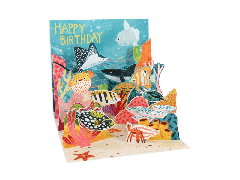 White envelope containing a holographic foil birthday card with full color print.
