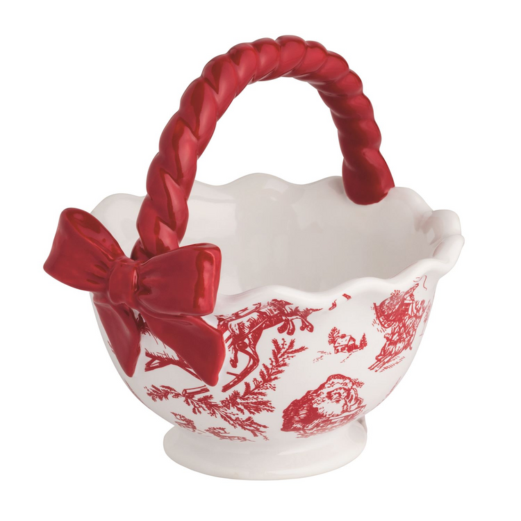 Stoneware candy bowl with red twisted handle, bow, and festive toile pattern on a pedestal base.